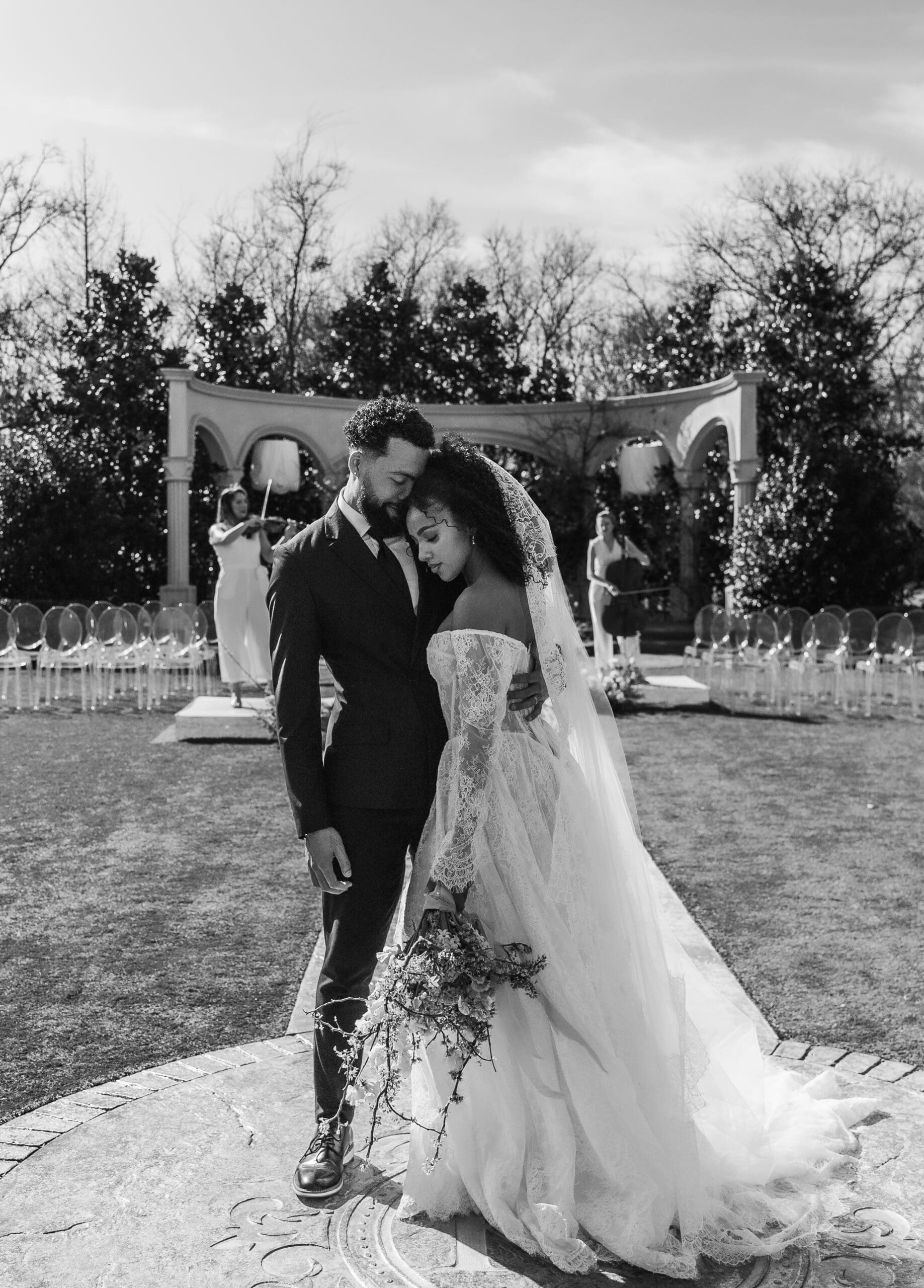 Bride and groom share an intimate moment at a garden ceremony