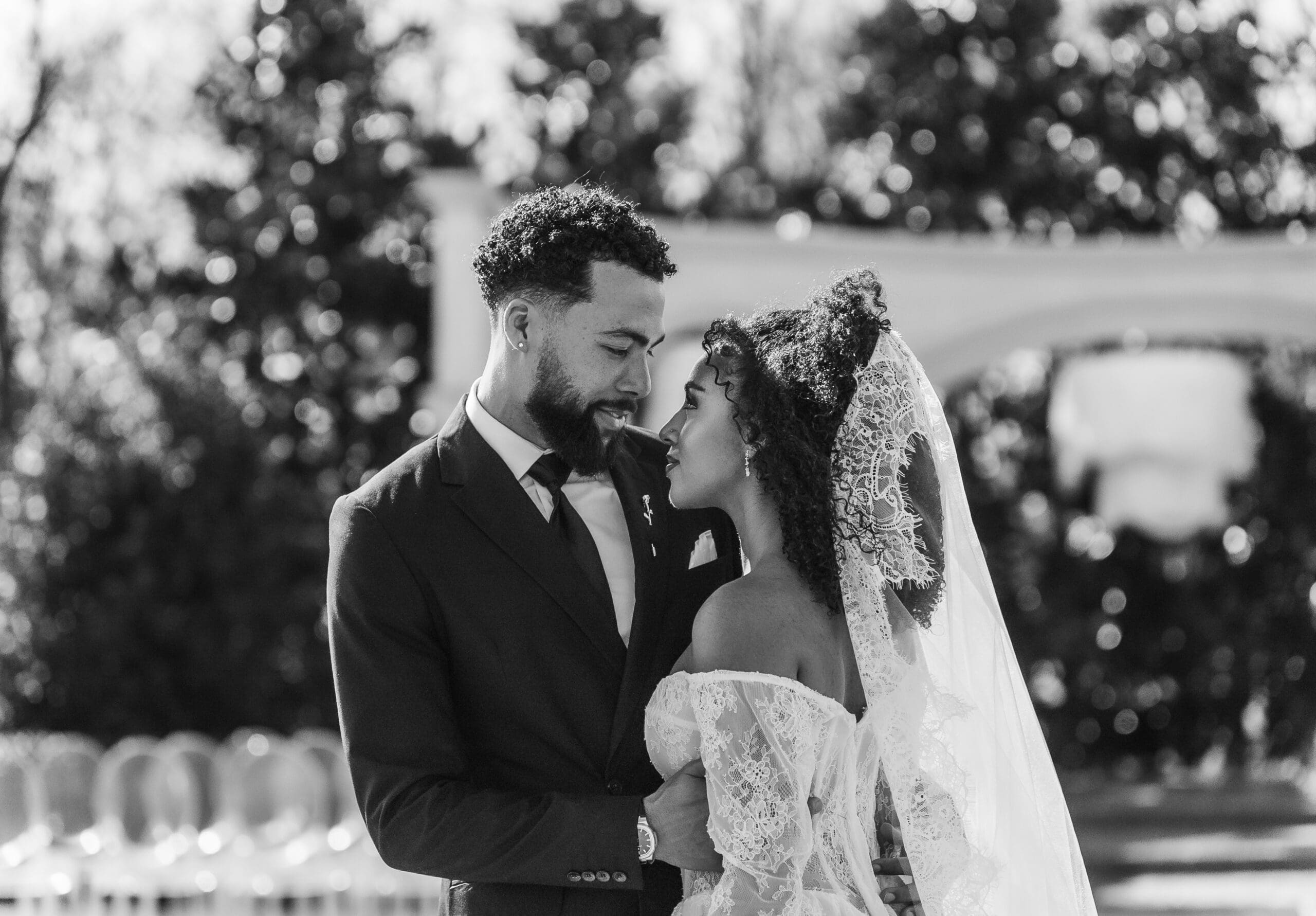 Bride and groom during golden hour in an open field