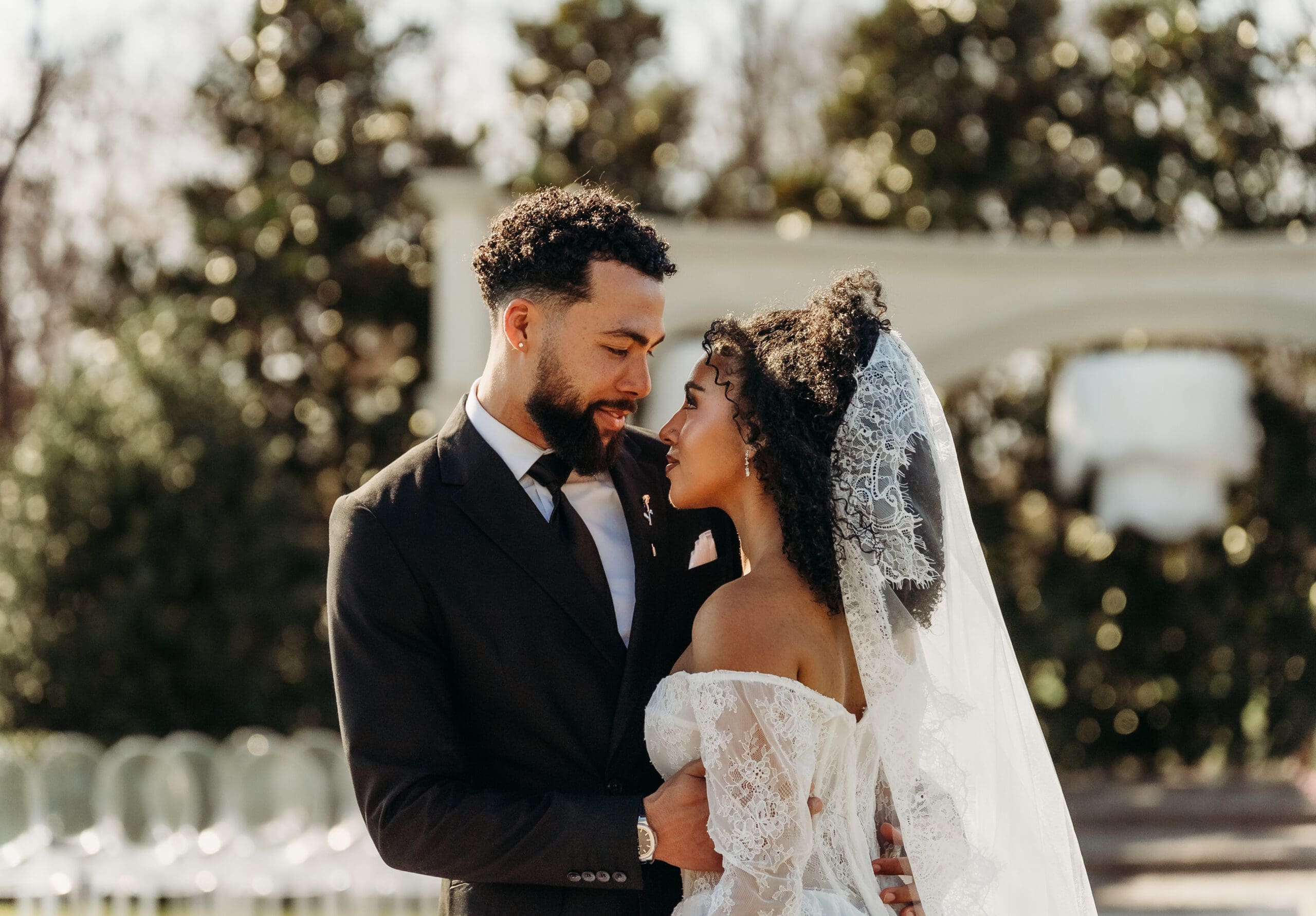 Bride and groom share an intimate golden hour moment