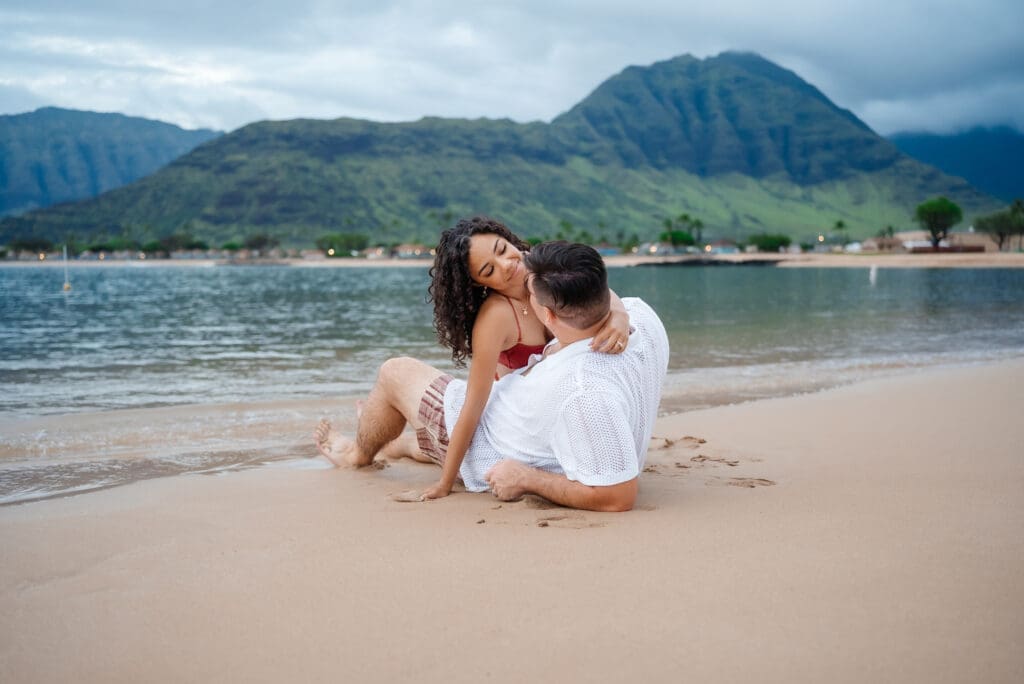 Couple on Hawaii beach with mountain view